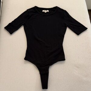 Women’s black sleek crewneck bodysuit